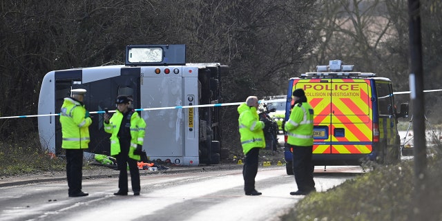 Police attend the scene of a bus crash near Cannington, Britain, January 17, 2023.