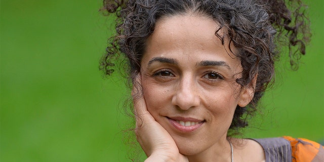 Masih Alinejad, 37, a Britain-based Iranian journalist, poses for a portrait in London, Oct. 8, 2013. Alinejad, a former reporter in Iran, left the country a week before the 2009 elections to study abroad and stayed outside after the unrest and crackdown on reformist press. 