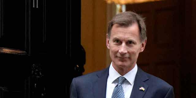 Britain's Chancellor Jeremy Hunt is shown on his way to attend Parliament in London, on Nov. 17, 2022. Hunt said on Jan. 27, 2023, that taming inflation is more important than cutting taxes.