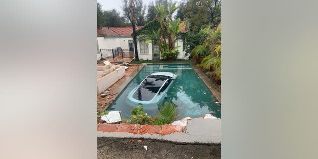 Telsa with two adults and one child crashed and plunged into the Pasadena Basin during California storms.