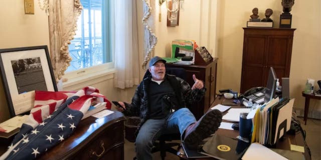 Arkansas man who put feet on Nancy Pelosi's desk during Capitol protest sentenced to 4.5 years in prison 2 Bigo with his feet up on Nancy Pelosi's desk