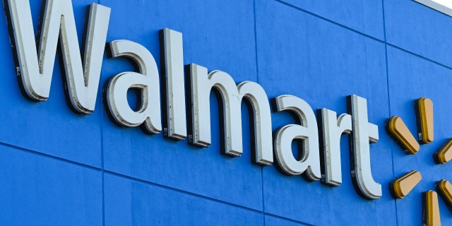 The Walmart logo is seen outside a Walmart store in Burbank, California, on Aug. 15, 2022. 