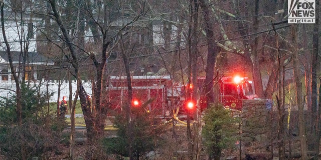 Firefighters battle a blaze at 725 Jerusalem Road in Cohasset, MA on Friday, January 7, 2023. The home once belonged to Ana Walshe who has been reported missing, last seen on New Year's Day.