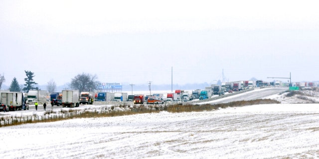 Emergency crews respond to a multi-vehicle crash in both the northbound and southbound lanes of Interstate 39/90 on Friday, January 27, 2023 in Turtle, Wisconsin.