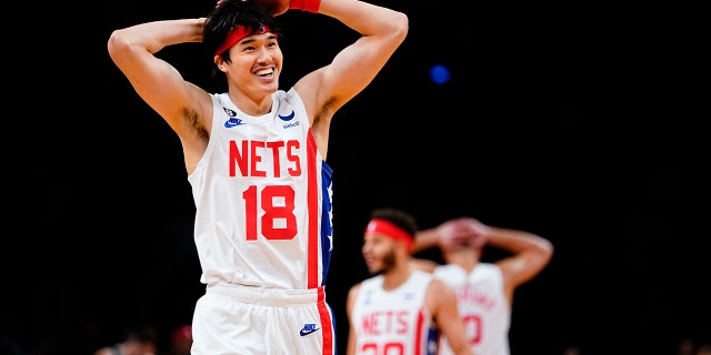 Yuta Watanabe (18) of the Brooklyn Nets of Japan celebrates with teammates after a Kyrie Irving dunk during the first half of an NBA basketball game against the San Antonio Spurs, Monday, Jan. 2. 2023, in New York.