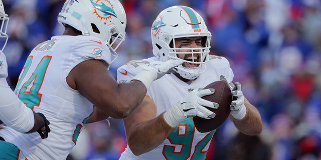 Miami Dolphins defensive tackle Zach Sieler (92) celebrates after his touchdown during the second half of an NFL Wild Card playoff football game against the Buffalo Bills, Sunday, Jan. 15, 2023, in Orchard Park, New York.
