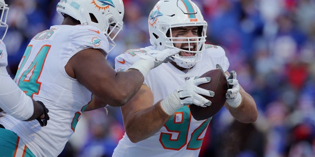 Miami Dolphins defensive tackle Zach Sieler (92) celebrates after his touchdown during the second half of an NFL wild-card playoff football game against the Buffalo Bills, Sunday, Jan. 15, 2023, in Orchard Park, New York.