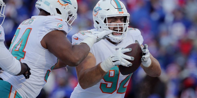 Miami Dolphins defensive tackle Zach Sieler (92) celebrates after his touchdown during the second half of an NFL Wild Card playoff football game against the Buffalo Bills, Sunday, Jan. 15, 2023, in Orchard Park, New York.