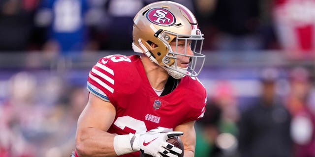 San Francisco 49ers' Christian McCaffrey carries the ball against the Dallas Cowboys during the first quarter of an NFC divisional game at Levi's Stadium, Jan. 22, 2023, in Santa Clara, Calif. 