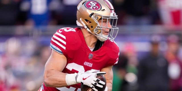 San Francisco 49ers' Christian McCaffrey carries the ball against the Dallas Cowboys during the first quarter of an NFC divisional game at Levi's Stadium, Jan. 22, 2023, in Santa Clara, Calif.