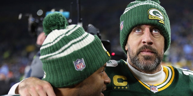 Green Bay Packers quarterback Aaron Rodgers, #12, and Green Bay Packers wide receiver Randall Cobb, #18, walk off the field after a game between the Green Bay Packers and Detroit Lions in Lambeau Field on January 8, 2023 in Green Bay.  , Wisconsin.