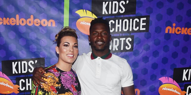 Chelsie Kyriss and NFL player Antonio Brown pose backstage at the Nickelodeon Kids' Choice Sports 2018 at Barker Hangar July 19, 2018, in Santa Monica, Calif. 