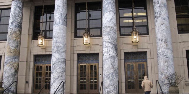 A person walks up the steps of the Alaska Capitol on Jan. 16, 2023, in Juneau, Alaska.