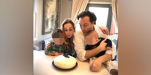 Ana and Brian Walshe blow out candles on a birthday cake with their children in an April 2020 Instagram post. 