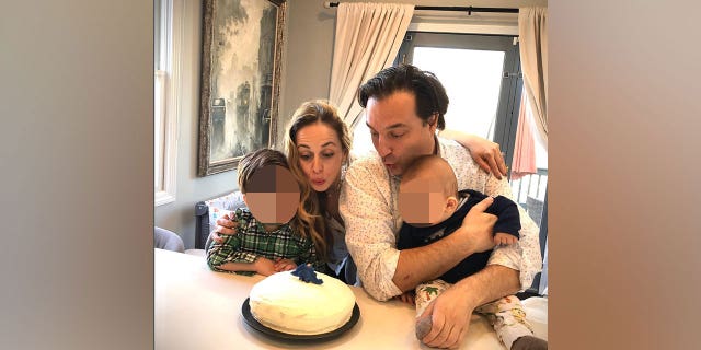 Ana and Brian Walshe blow out candles on a birthday cake with their children in an April 2020 Instagram post. 