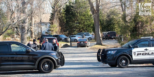 Law enforcement and investigators returning to Walshe home in Cohasset, MA. Law enforcement appears to have moved family out of house to investigate contents.