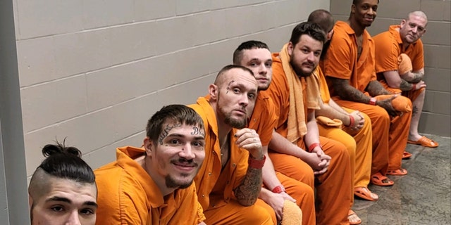 Male inmates at the Decatur Detention Center line up to be baptized in a photo posted to the Facebook page of the Decatur County Sheriff's Office on Dec. 29, 2022.