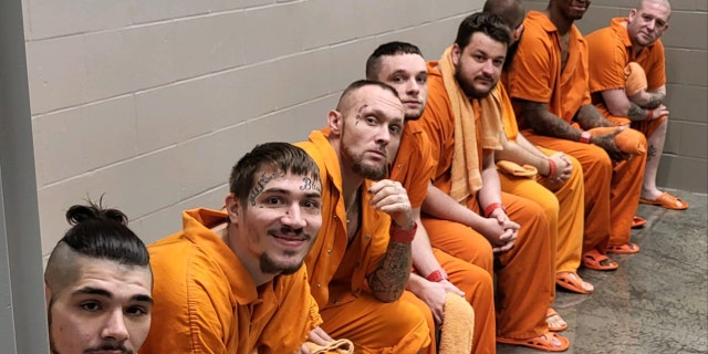 Male inmates at the Decatur Detention Center line up to be baptized in a photo posted to the Facebook page of the Decatur County Sheriff's Office on Dec. 29, 2022.