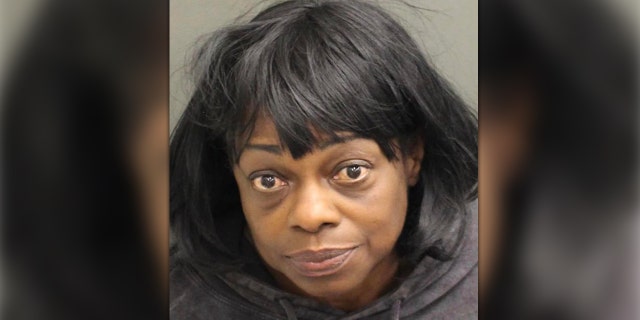 Angila Baxter, 56, is charged in the shooting death of Nekaybaw Collier, 27.