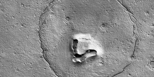 The University of Arizona released this photo of a formation on the surface of Mars that resembles a bear's face. 