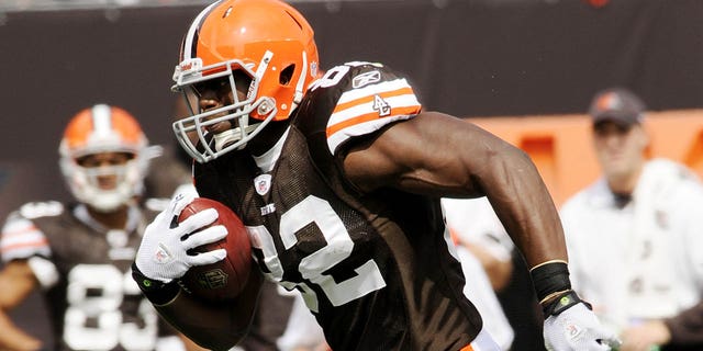 Cleveland Browns tight end Ben Watson #82 carries the ball after catching a pass during a game with the Kansas City Chiefs on September 19, 2010 at Cleveland Browns Stadium in Cleveland.