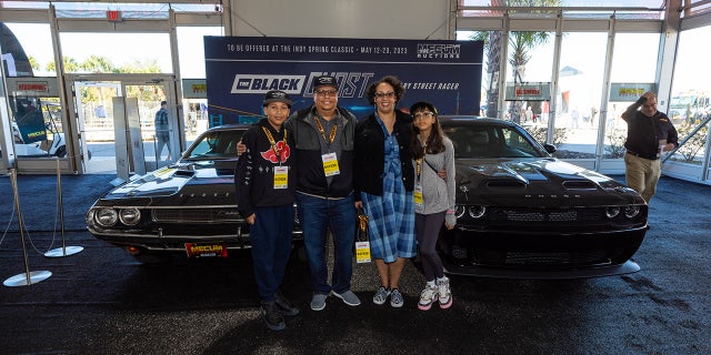 Geoffrey Qualls (shown with his family) only learned about the car's history in recent years.