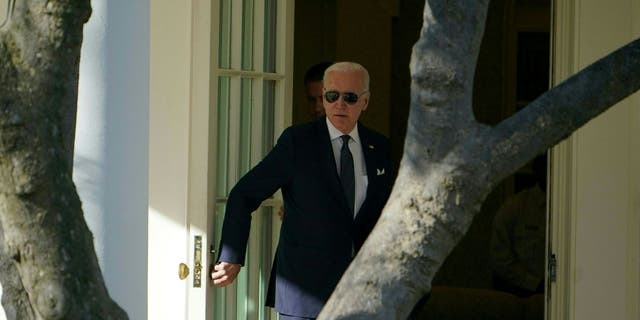 President Biden walks to the Oval Office on Monday.