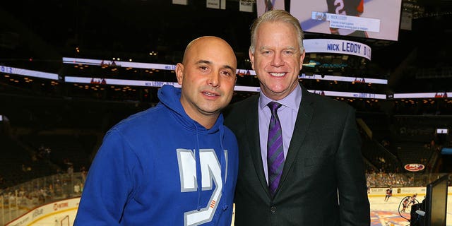 Craig Carton and Boomer Esiason pose for a photo prior to calling a game between the New York Islanders and the Pittsburgh Penguins on WFAN at the Barclays Center Nov. 30, 2016, in the Brooklyn borough of New York City. 