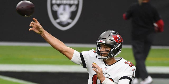 Tampa Bay Buccaneers quarterback Tom Brady #12 warms up prior to the team's game against the Las Vegas Raiders at Elegant Stadium on October 25, 2020 in Las Vegas, Nevada. The Buccaneers defeated the Raiders 45–20.