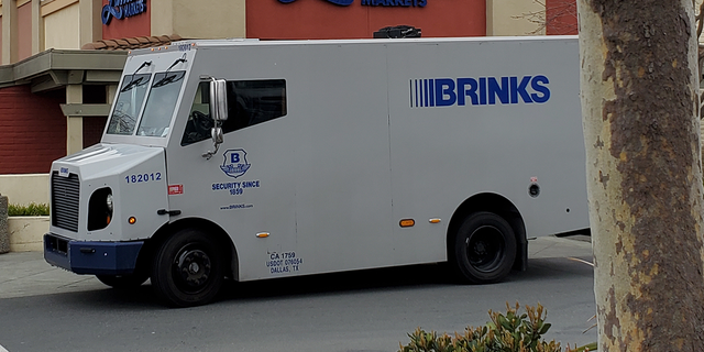 The Hyattsville Police Department says a Brink's employee was retrieving money from an ATM when the employee was approached by two masked gunmen. Shown here is a Brink's truck in California.