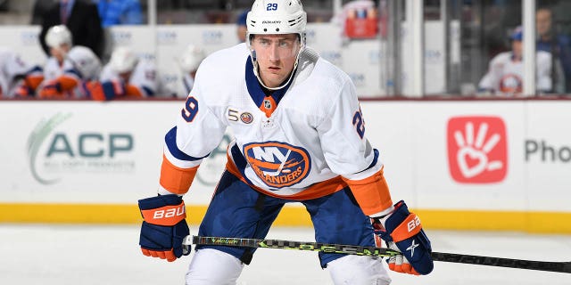 Brock Nelson of the New York Islanders gets ready during a face-off against the Arizona Coyotes at Mullett Arena Dec. 16, 2022, in Tempe, Ariz.