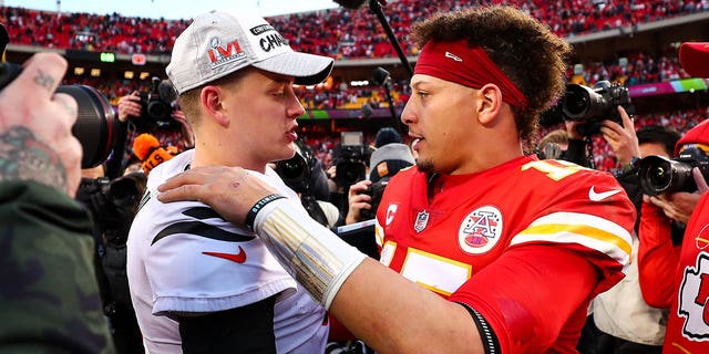 Joe Burrows, left, of the Cincinnati Bengals embraces Patrick Mahomes of the Kansas City Chiefs after the AFC Championship game at GEHA Field at Arrowhead Stadium January 30, 2022, in Kansas City, Mo.