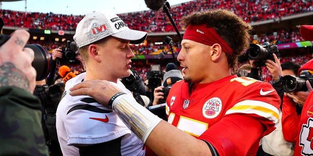 Joe Burrow, #9 of the Cincinnati Bengals, hugs Patrick Mahomes, #15 of the Kansas City Chiefs, after the AFC Championship Game at GEHA Field at Arrowhead Stadium on January 30, 2022 in Kansas City, Missouri.