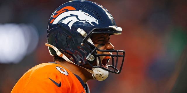 Russell Wilson #3 of the Denver Broncos celebrates after throwing a touchdown pass during the fourth quarter against the Los Angeles Chargers at Empower Field At Mile High on January 8, 2023 in Denver, Colorado.