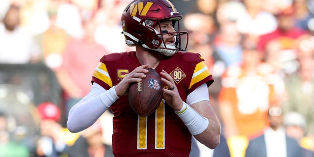 Carson Wentz of the Washington Commanders drops back to pass against the Cleveland Browns at FedExField on January 1, 2023 in Landover, Maryland.