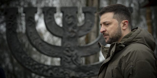 Ukrainian President Volodymyr Zelenskyy attends the ceremony at a Menorah memorial at the Babyn Yar National Historical and Memorial Reserve in honor of Holocaust Memorial Day, Jan. 27, 2023.