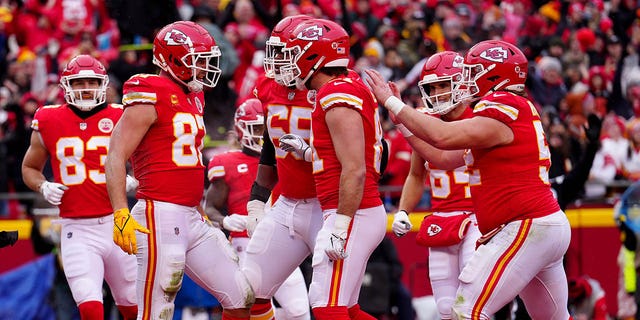 Travis Kelce (87) of the Kansas City Chiefs celebrates with teammates after scoring an 8-yard touchdown run against the Jacksonville Jaguars during the first quarter in an AFC divisional playoff game at Arrowhead Stadium on January 1, 2019. January 21, 2023, in Kansas City, Missouri. 