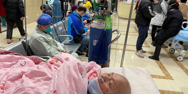 A patient lies on a bed at the emergency department of a hospital amid a coronavirus outbreak in Shanghai, China, on Jan. 17, 2023.