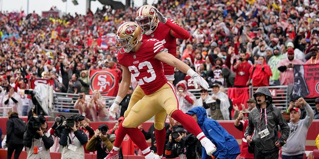 San Francisco 49ers running back Christian McCaffrey (23) is congratulated by wide receiver Jauan Jennings after scoring against the Seattle Seahawks during the first half of an NFL wild-card playoff game in Santa Clara, Calif., Saturday, Jan. 14, 2023.