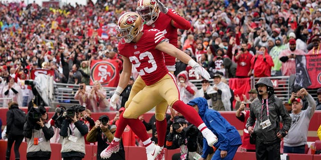 San Francisco 49ers running back Christian McCaffrey (23) is congratulated by wide receiver Jauan Jennings after scoring against the Seattle Seahawks during the first half of an NFL wild-card playoff game in Santa Clara, Calif., Saturday, Jan. 14, 2023.