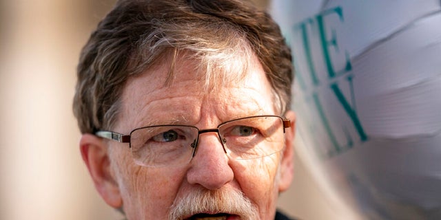 Jack Phillips, whose case was heard by the Supreme Court five years ago after he objected to designing a wedding cake for a gay couple, speaks to supporters outside the Supreme Court in Washington, D.C., on Dec. 5, 2022.