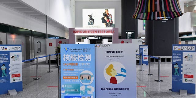 A sign representing coronavirus testing is displayed at the Malpensa Airport in Milan, Italy, on Dec. 29, 2022. 