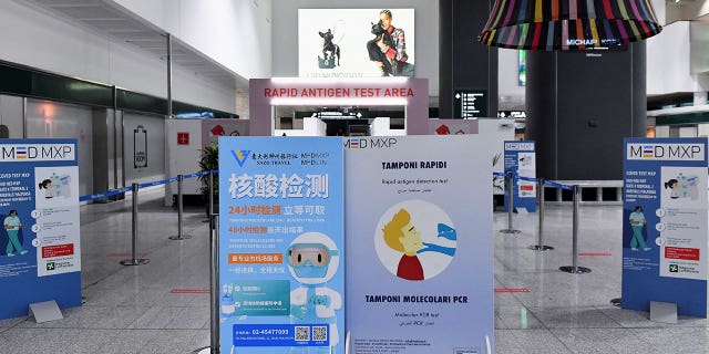 A sign representing coronavirus testing is displayed at the Malpensa Airport in Milan, Italy, on Dec. 29, 2022. 