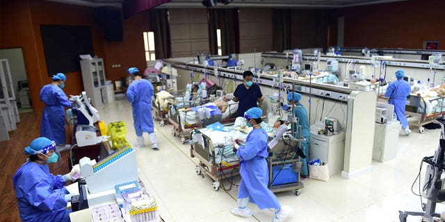 Medical workers attend to COVID patients at a hospital in Cangzhou, Hebei province, China, on Jan. 11, 2023. 