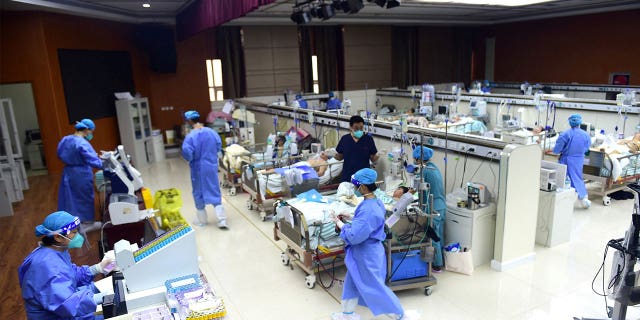 Medical workers attend to COVID patients at a hospital in Cangzhou, Hebei province, China, on Jan. 11, 2023.
