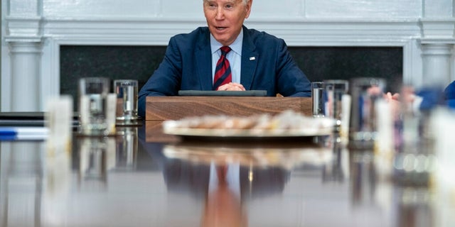 President Joe Biden speaks during a meeting with Democratic lawmakers in the Roosevelt Room of the White House. During the meeting, Biden touched on the economy and other issues.