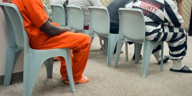 Inmates wait for their video arraignments at the Saginaw County Jail in Saginaw, Mich. The so-called "Clean Slate" law could enable authorities to automatically expunge criminal convictions for 400,000 Michigan residents.