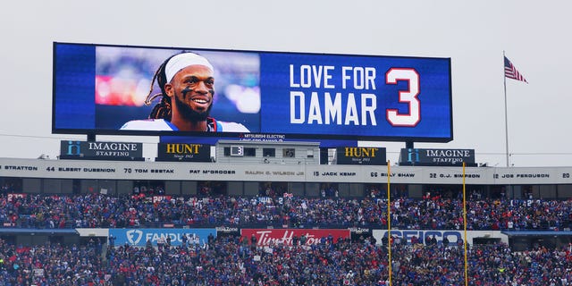 The scoreboard displays a message of support for Damar Hamlin during a game between the New England Patriots and the Buffalo Bills at Highmark Stadium on January 8, 2023 in Orchard Park, NY.