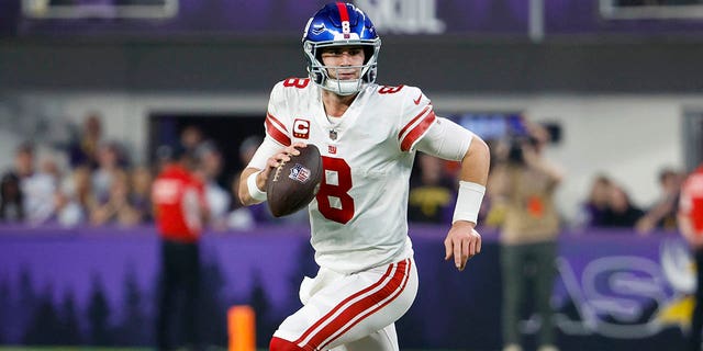 Daniel Jones of the New York Giants looks to pass against the Minnesota Vikings during the first half in an NFC wild-card playoff game at U.S. Bank Stadium Jan. 15, 2023, in Minneapolis. 