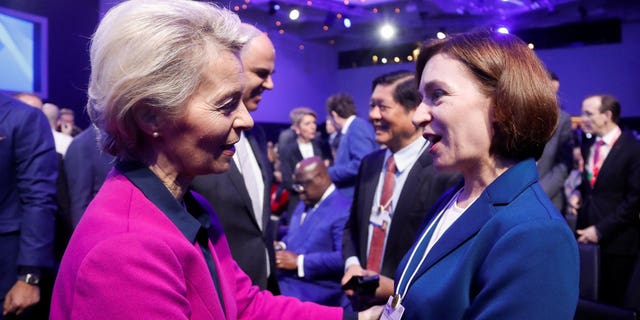 European Commission President Ursula von der Leyen, left, announced Europe's intention to compete with American climate policy while addressing the Davos conference Tuesday.